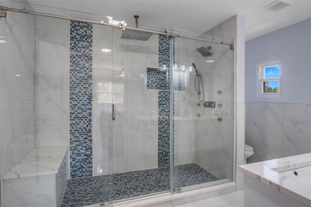 40140 Swift Rd, Eustis, FL 32736 - bathroom with tile walls, a stall shower, vanity, and toilet