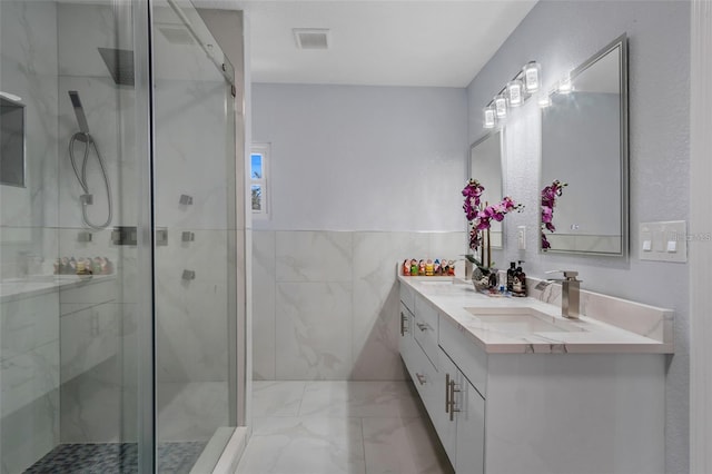 40140 Swift Rd, Eustis, FL 32736 - full bathroom with vanity, marble finish flooring, a marble finish shower, and tile walls
