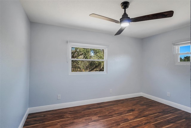 40140 Swift Rd, Eustis, FL 32736 - empty room featuring dark wood finished floors, a ceiling fan, and baseboards
