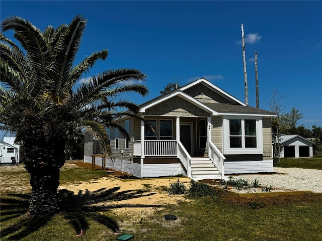 227 Bay St, Port St Joe, FL 32456 - view of front of home with a porch