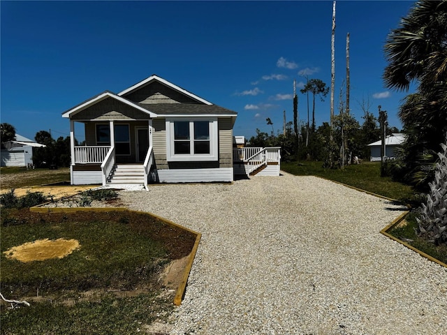 227 Bay St, Port St Joe, FL 32456 - manufactured / mobile home with covered porch