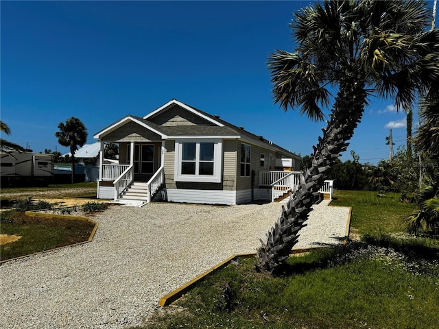 227 Bay St, Port St Joe, FL 32456 - manufactured / mobile home with covered porch