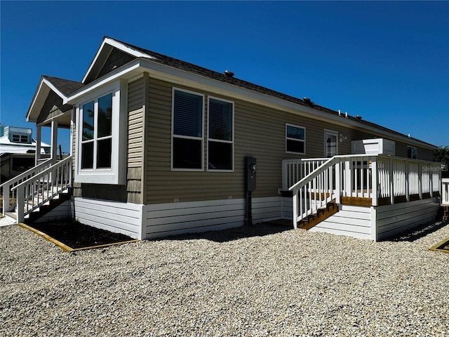 227 Bay St, Port St Joe, FL 32456 - view of home's exterior featuring stairway and a deck