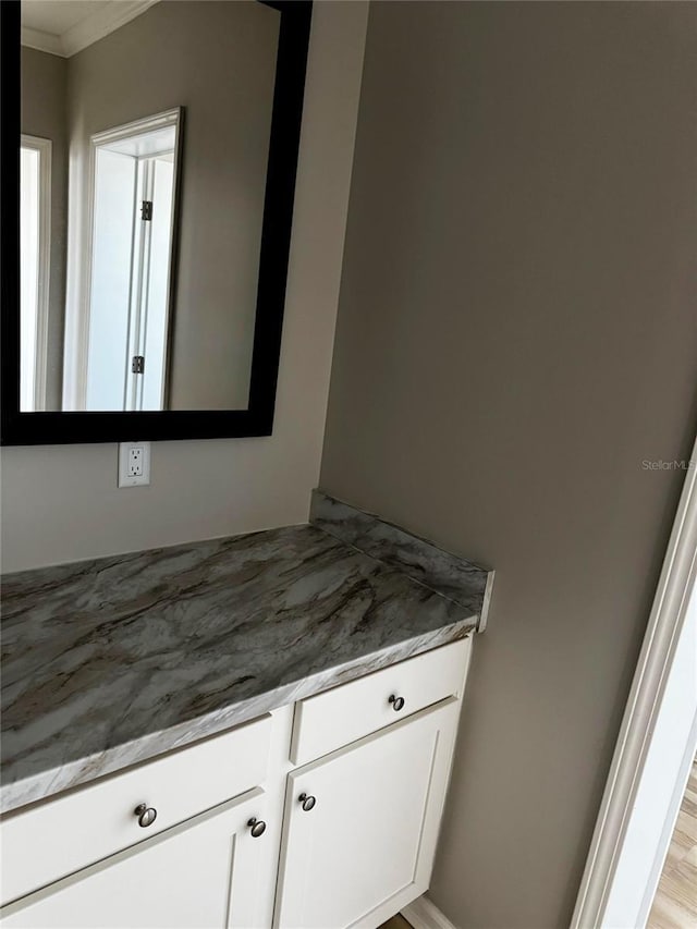 227 Bay St, Port St Joe, FL 32456 - bathroom featuring crown molding and vanity