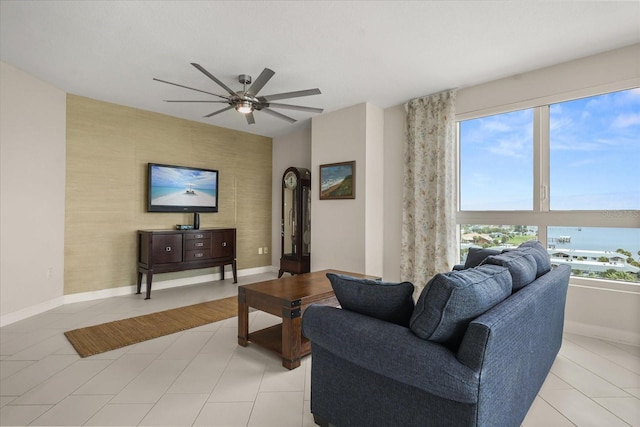 241 Riverside Dr Unit 902, Holly Hill, FL 32117 - living area featuring a ceiling fan, light tile patterned flooring, and an accent wall