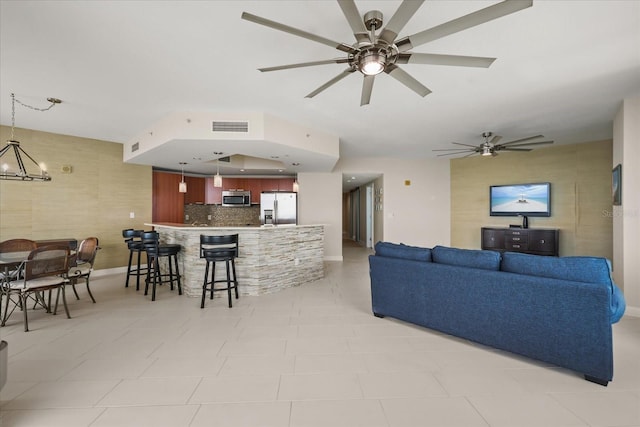 241 Riverside Dr Unit 902, Holly Hill, FL 32117 - living room with ceiling fan and a chandelier