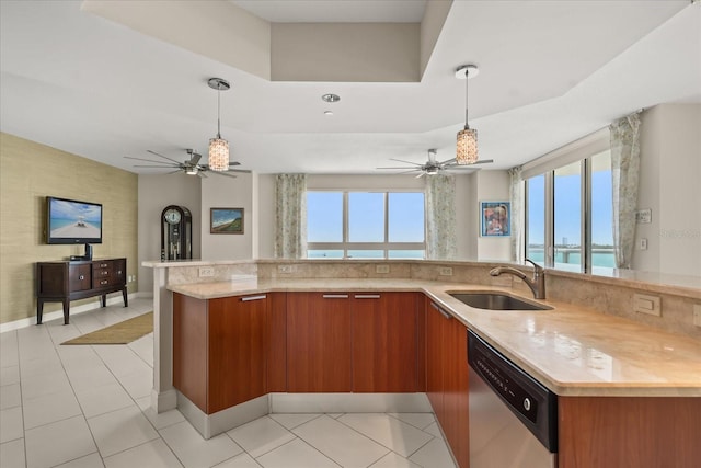 241 Riverside Dr Unit 902, Holly Hill, FL 32117 - kitchen featuring dishwasher, a ceiling fan, brown cabinetry, and hanging light fixtures