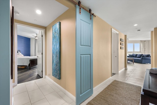 241 Riverside Dr Unit 902, Holly Hill, FL 32117 - hall featuring tile patterned flooring, recessed lighting, and a barn door