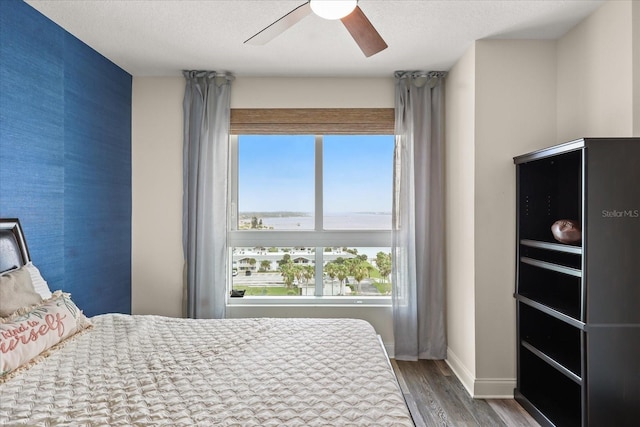 241 Riverside Dr Unit 902, Holly Hill, FL 32117 - bedroom featuring wood finished floors and a ceiling fan