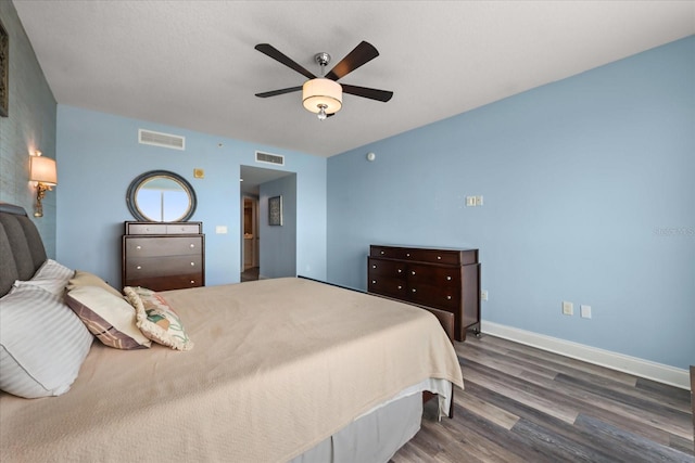 241 Riverside Dr Unit 902, Holly Hill, FL 32117 - bedroom with wood finished floors and ceiling fan