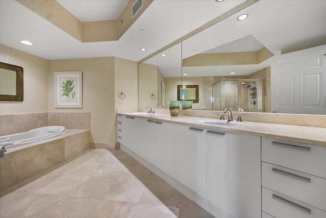 241 Riverside Dr Unit 902, Holly Hill, FL 32117 - bathroom featuring double vanity, a bath, a shower stall, and recessed lighting