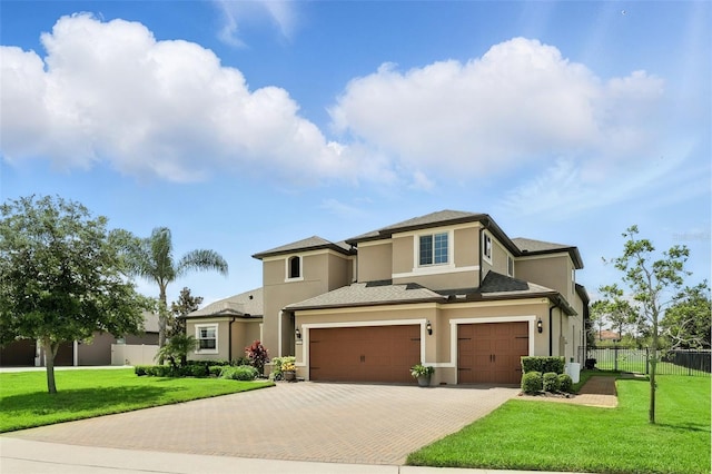 2118 Whiting Trl, Orlando, FL 32820 - view of front of home with an attached garage, decorative driveway, and stucco siding