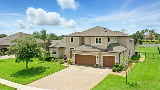 2118 Whiting Trl, Orlando, FL 32820 - view of front of property featuring stucco siding, decorative driveway, an attached garage, and a shingled roof