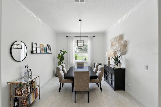 2118 Whiting Trl, Orlando, FL 32820 - dining space with crown molding and a textured ceiling
