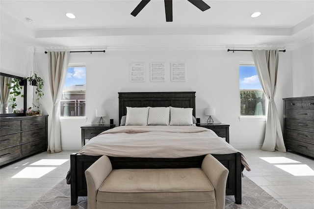 2118 Whiting Trl, Orlando, FL 32820 - bedroom featuring multiple windows, recessed lighting, ceiling fan, and a tray ceiling