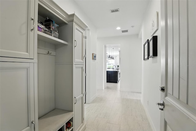 2118 Whiting Trl, Orlando, FL 32820 - mudroom with baseboards and recessed lighting