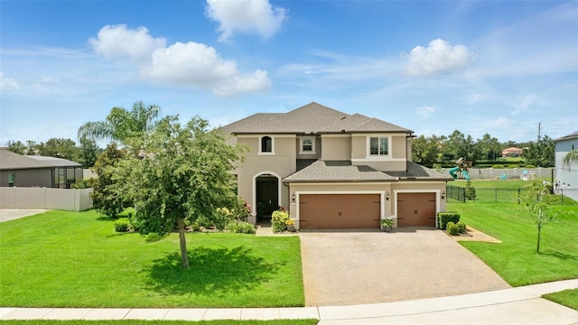 2118 Whiting Trl, Orlando, FL 32820 - view of front facade featuring a garage, decorative driveway, stucco siding, and a shingled roof
