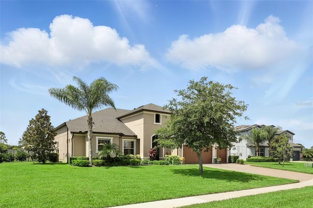 2118 Whiting Trl, Orlando, FL 32820 - view of front facade featuring stucco siding, an attached garage, concrete driveway, and a front lawn