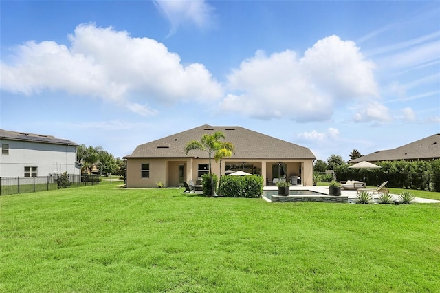 2118 Whiting Trl, Orlando, FL 32820 - back of house with a patio area, an outdoor hangout area, stucco siding, and roof with shingles