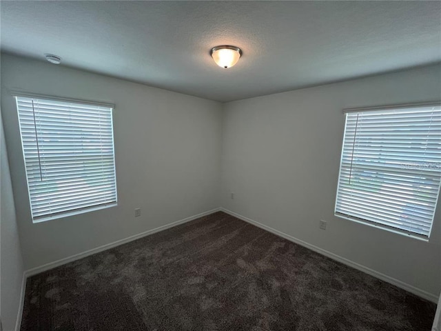 477 Madison Dr, Davenport, FL 33837 - carpeted empty room featuring baseboards