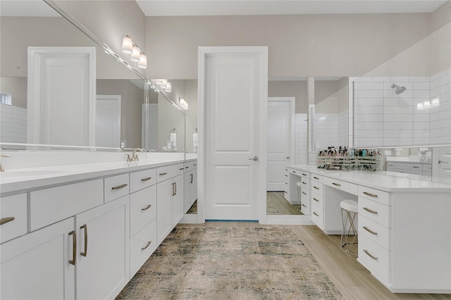 1938 Filly Trl, Oviedo, FL 32765 - full bathroom with double vanity, wood finished floors, and tiled shower