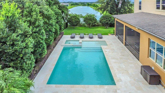 1938 Filly Trl, Oviedo, FL 32765 - view of swimming pool with a sunroom, a pool with connected hot tub, a yard, a water view, and a patio