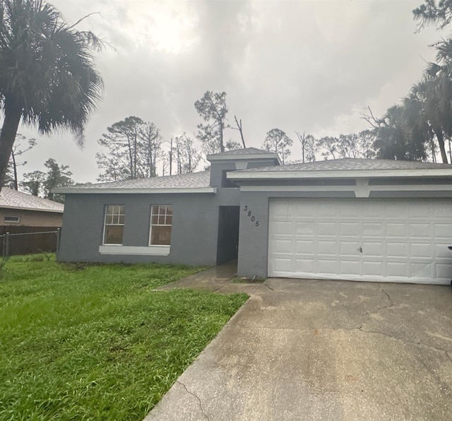 3805 N Cranberry Blvd, North Port, FL 34286 - view of front of home with stucco siding, concrete driveway, an attached garage, and a shingled roof