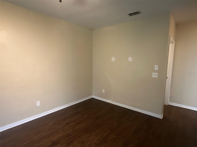 3805 N Cranberry Blvd, North Port, FL 34286 - unfurnished room with dark wood-style floors and baseboards