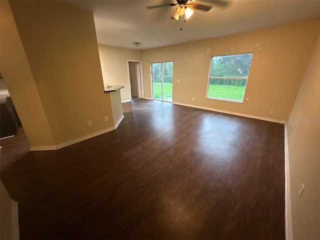 3805 N Cranberry Blvd, North Port, FL 34286 - empty room with a ceiling fan and dark wood-style floors