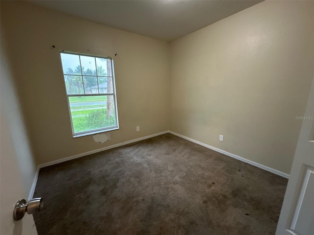 3805 N Cranberry Blvd, North Port, FL 34286 - unfurnished room with dark colored carpet and baseboards