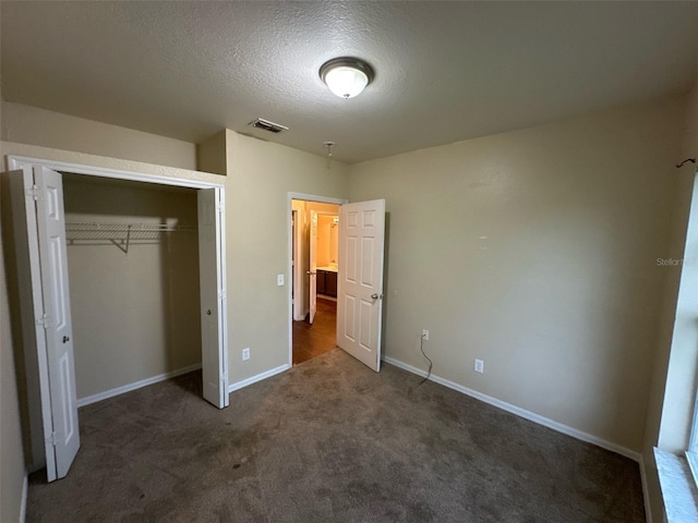 3805 N Cranberry Blvd, North Port, FL 34286 - unfurnished bedroom featuring carpet flooring, a textured ceiling, and a closet