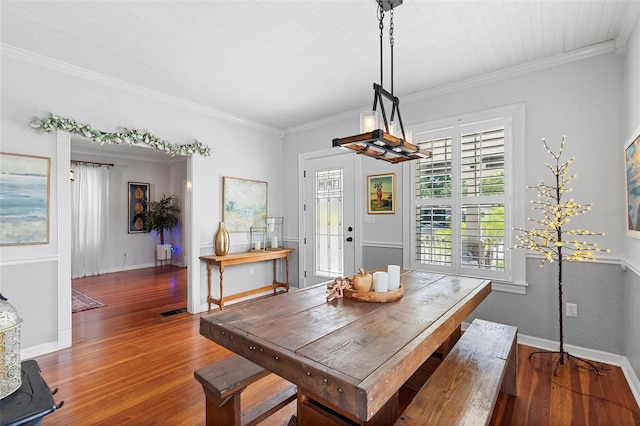 6501 Matchett Rd, Belle Isle, FL 32809 - dining area featuring hardwood / wood-style flooring and ornamental molding