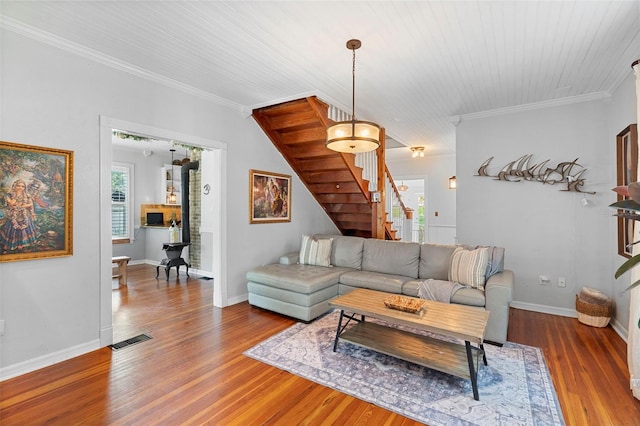 6501 Matchett Rd, Belle Isle, FL 32809 - living area featuring stairway, wood finished floors, and ornamental molding