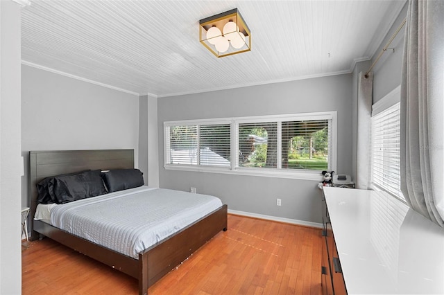 6501 Matchett Rd, Belle Isle, FL 32809 - bedroom featuring wood finished floors and crown molding