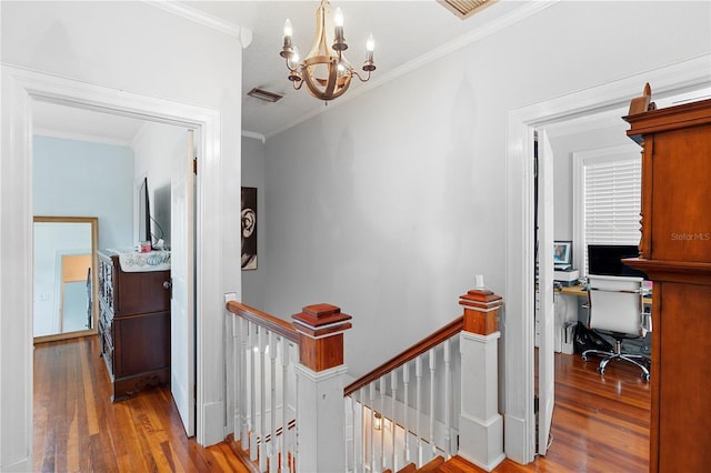 6501 Matchett Rd, Belle Isle, FL 32809 - hall with an upstairs landing, hardwood / wood-style floors, a chandelier, and ornamental molding