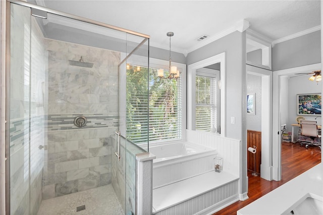 6501 Matchett Rd, Belle Isle, FL 32809 - bathroom featuring a stall shower, ornamental molding, a bath, wood finished floors, and a chandelier