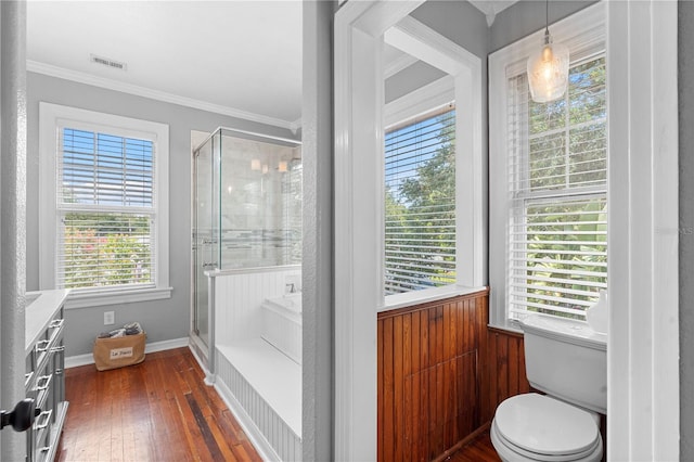 6501 Matchett Rd, Belle Isle, FL 32809 - bathroom with a stall shower, crown molding, and wood-type flooring