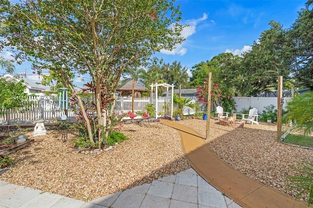 6501 Matchett Rd, Belle Isle, FL 32809 - view of yard featuring an outdoor fire pit