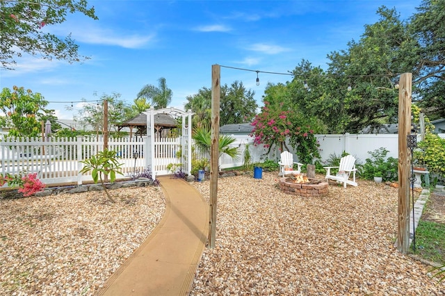 6501 Matchett Rd, Belle Isle, FL 32809 - fenced yard featuring a fire pit and a pergola
