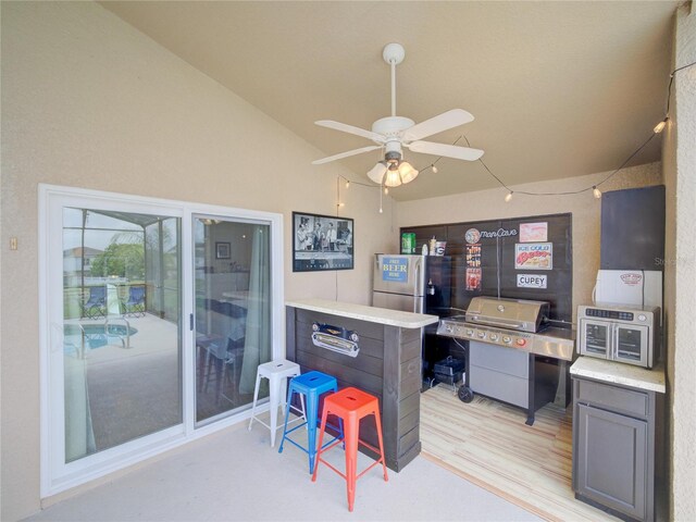 456 Old Bridge Cir, Davenport, FL 33897 - office space with lofted ceiling, a ceiling fan, and light wood-type flooring