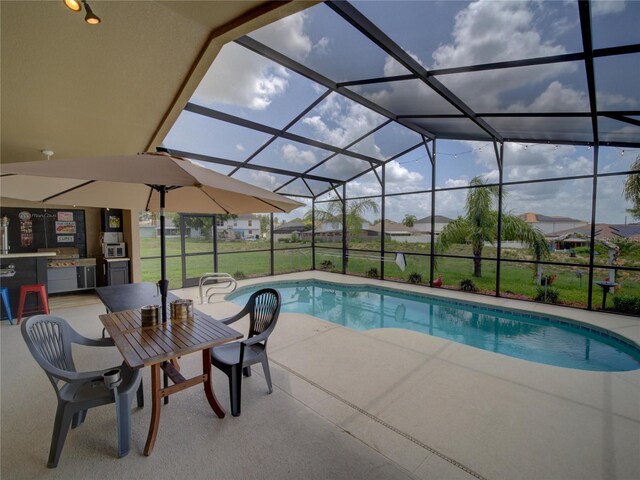 456 Old Bridge Cir, Davenport, FL 33897 - outdoor pool with a patio area and glass enclosure
