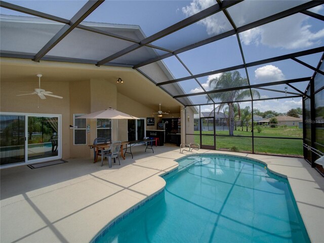 456 Old Bridge Cir, Davenport, FL 33897 - swimming pool with ceiling fan, a patio, and glass enclosure