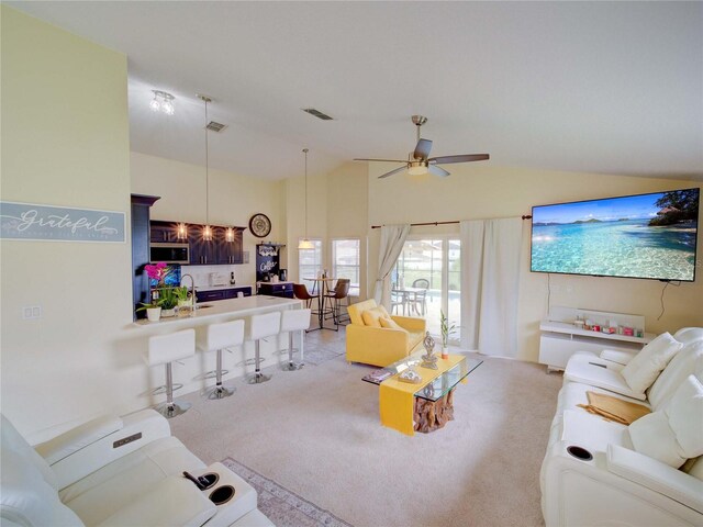 456 Old Bridge Cir, Davenport, FL 33897 - living area with light carpet, a ceiling fan, and high vaulted ceiling