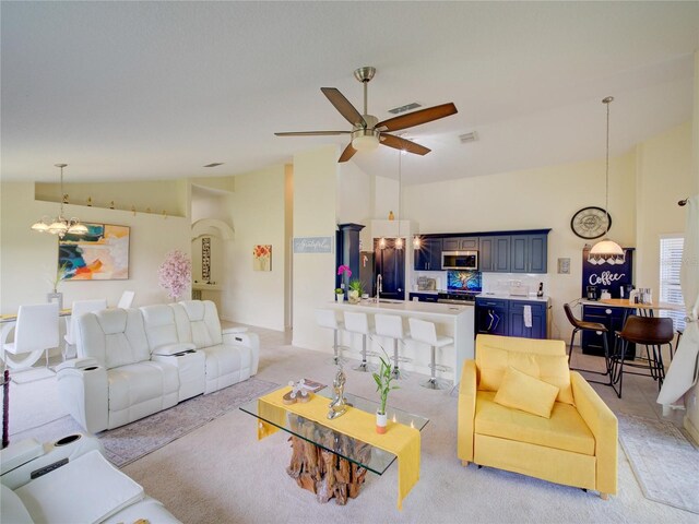 456 Old Bridge Cir, Davenport, FL 33897 - living room with a chandelier, light colored carpet, a ceiling fan, and high vaulted ceiling