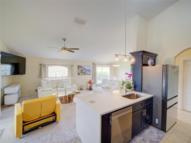 456 Old Bridge Cir, Davenport, FL 33897 - kitchen with open floor plan, freestanding refrigerator, light countertops, ceiling fan, and hanging light fixtures