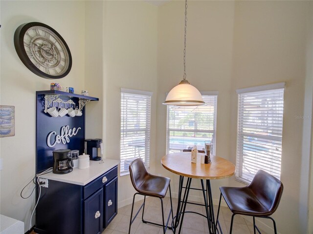 456 Old Bridge Cir, Davenport, FL 33897 - dining area with a high ceiling and light tile patterned floors
