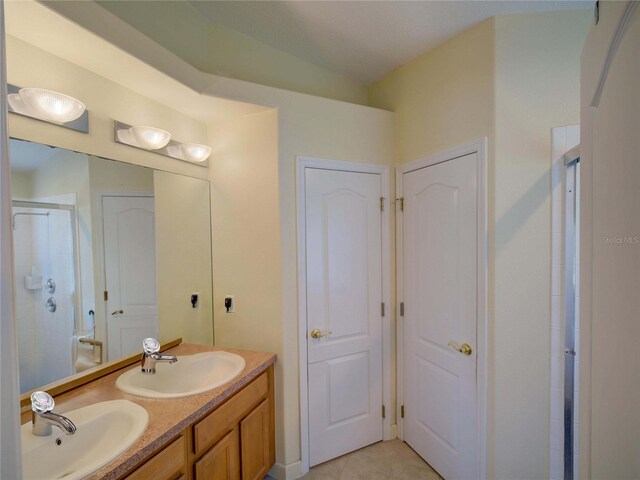 456 Old Bridge Cir, Davenport, FL 33897 - bathroom with a shower stall, double vanity, and tile patterned floors