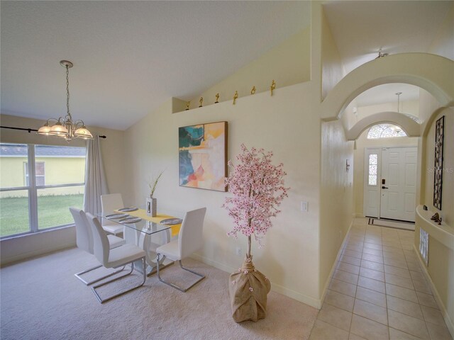 456 Old Bridge Cir, Davenport, FL 33897 - dining area with vaulted ceiling, a chandelier, and light tile patterned floors