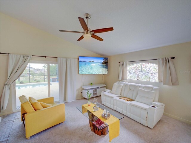 456 Old Bridge Cir, Davenport, FL 33897 - living area with plenty of natural light, carpet flooring, ceiling fan, and vaulted ceiling