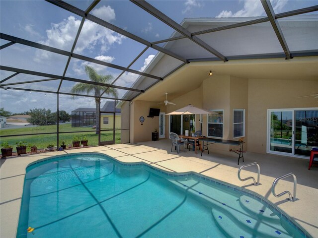 456 Old Bridge Cir, Davenport, FL 33897 - swimming pool featuring a patio area, a ceiling fan, and a lanai